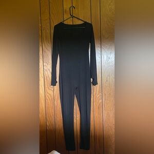 Black jumpsuit, super stretchy and tummy controlling.